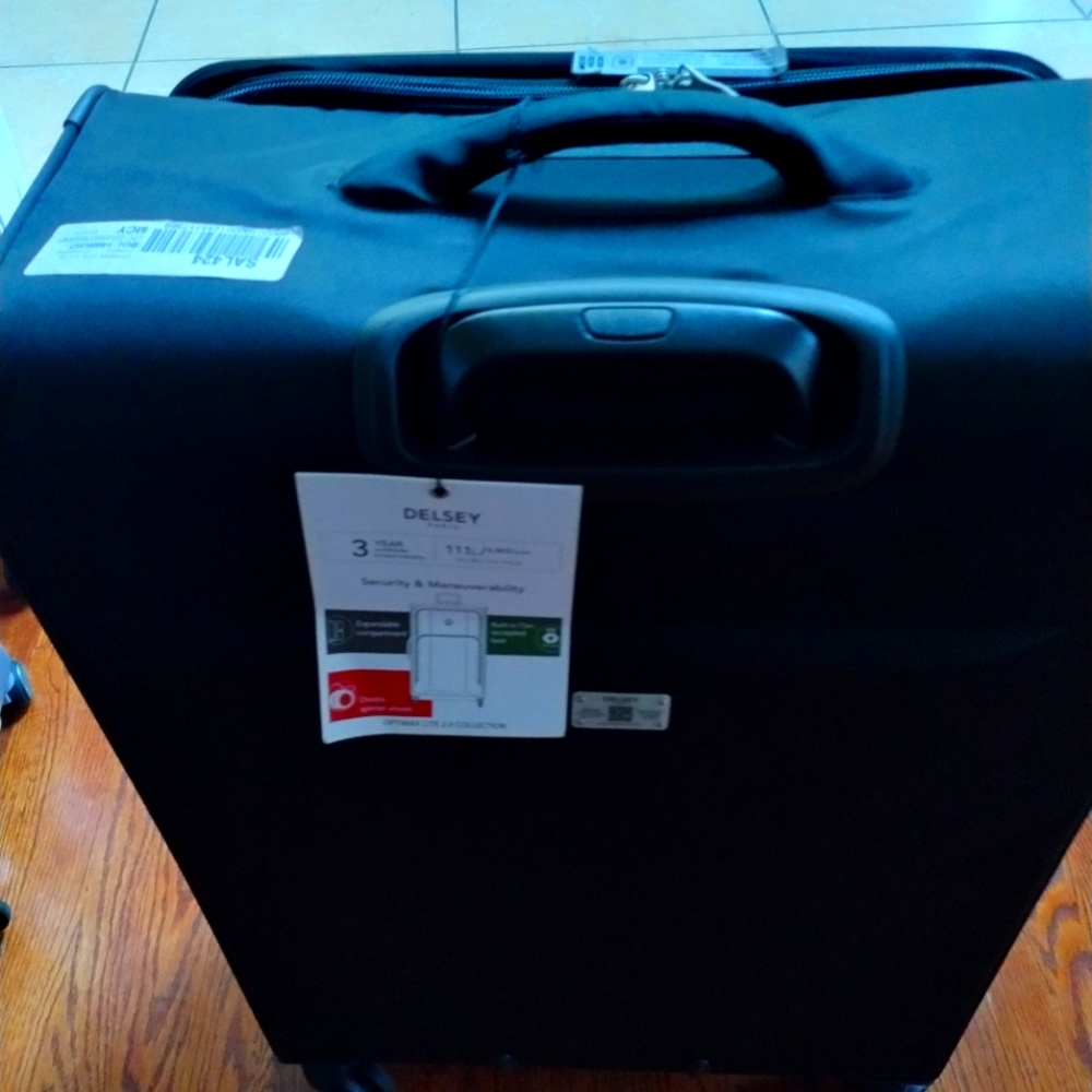 $420 Delsey 31" Exp. Spinner Trolley